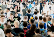 Therapy Treats the Individual, but the Problem Is the Self We Were Taught to Be Blurry photo of a crowd of people