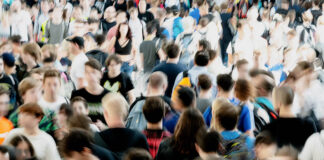 Therapy Treats the Individual, but the Problem Is the Self We Were Taught to Be Blurry photo of a crowd of people