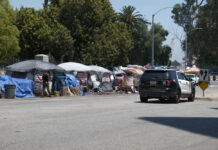 Mental Health and the Assault on Autonomy in the New America Los Angeles, CA USA - Julyl 3, 2021: Homeless tents outside the Veterans Administration in a stretch called Veterans Row