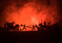 Four Thousand Years of Trauma, 45 Years of Diagnosis—Why Call a Fully Human Reaction a “Disorder”? Ancient soldiers in silhouette against an orange fog