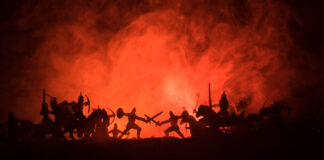 Four Thousand Years of Trauma, 45 Years of Diagnosis—Why Call a Fully Human Reaction a “Disorder”? Ancient soldiers in silhouette against an orange fog