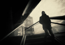 On the Autistic Spectrum or a Camus Anti-Hero? Rebellion Obtuseness in Psychiatry Artistic monochrome photograph of a lone man in a cityscape of harsh angles