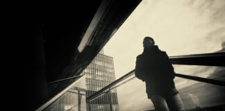 On the Autistic Spectrum or a Camus Anti-Hero? Rebellion Obtuseness in Psychiatry Artistic monochrome photograph of a lone man in a cityscape of harsh angles