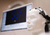 New Device for PTSD Being Sold to Veterans—No Evidence Provided to the Public Simulate wearing brain scanning waves, medical equipment In the laboratory with monitors showing reading and brain.